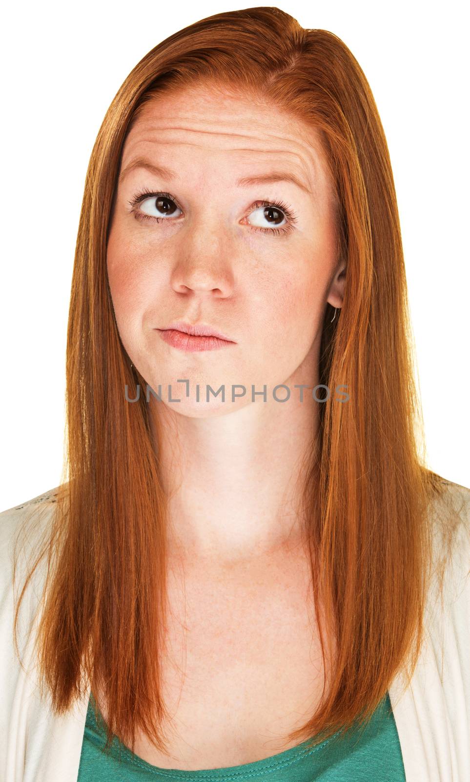 Isolated skeptical young Caucasian female with red hair