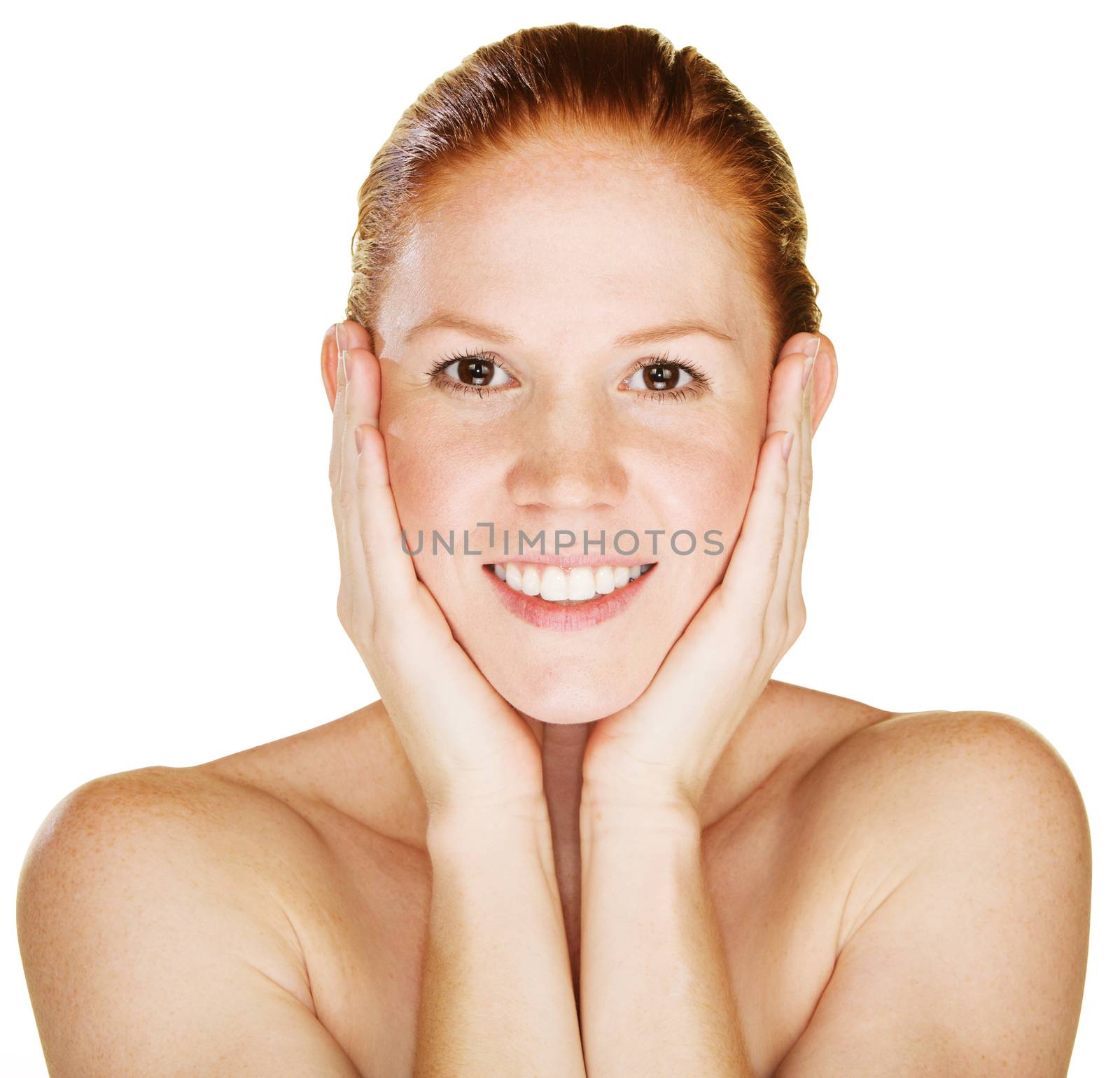 Smiling young woman with hands on face