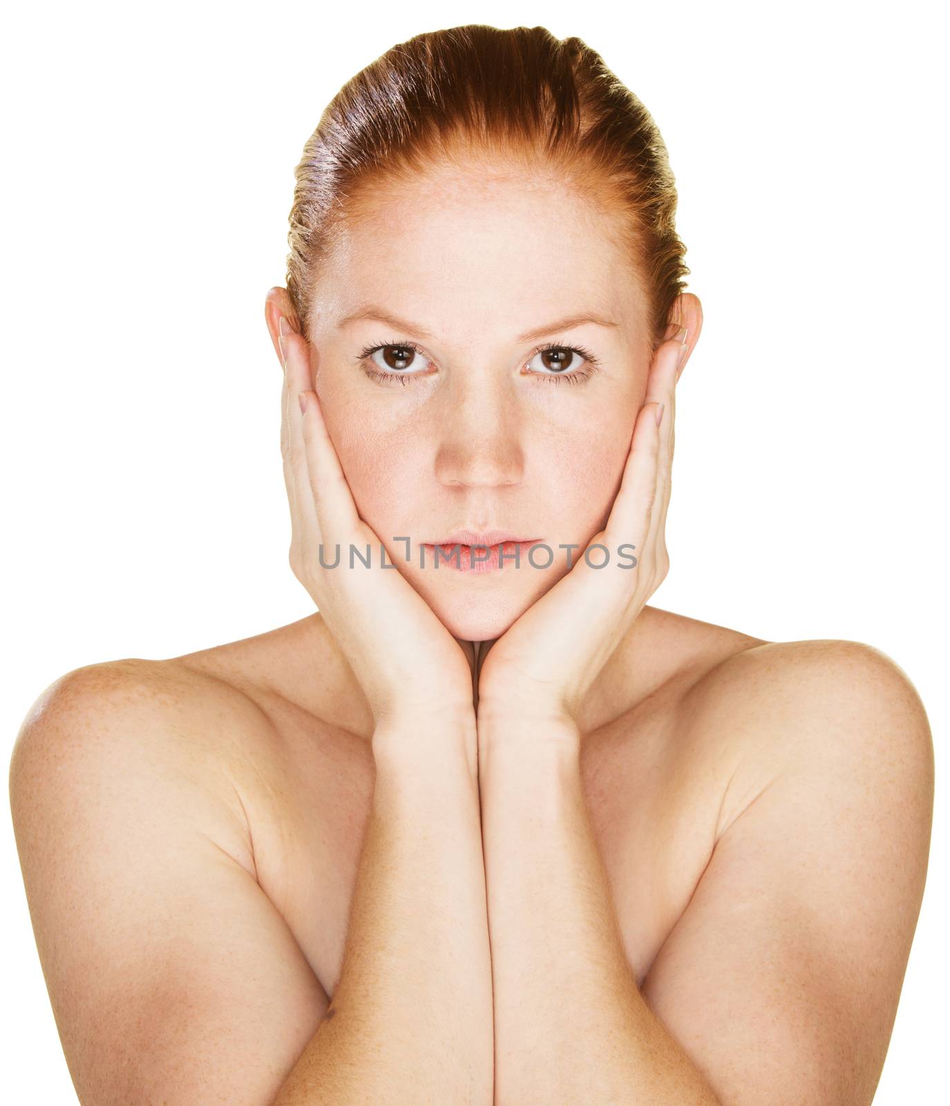 Serious woman holding face in palms over white