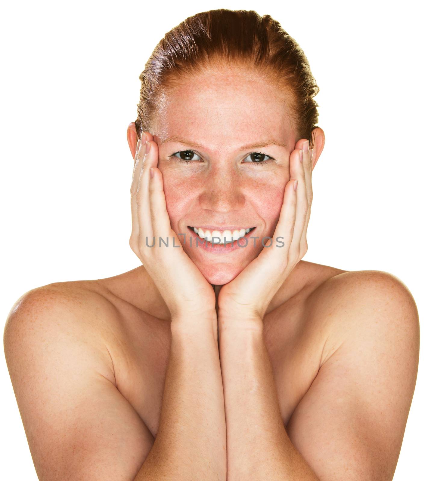 Isolated laughing woman with bare shoulders holding face