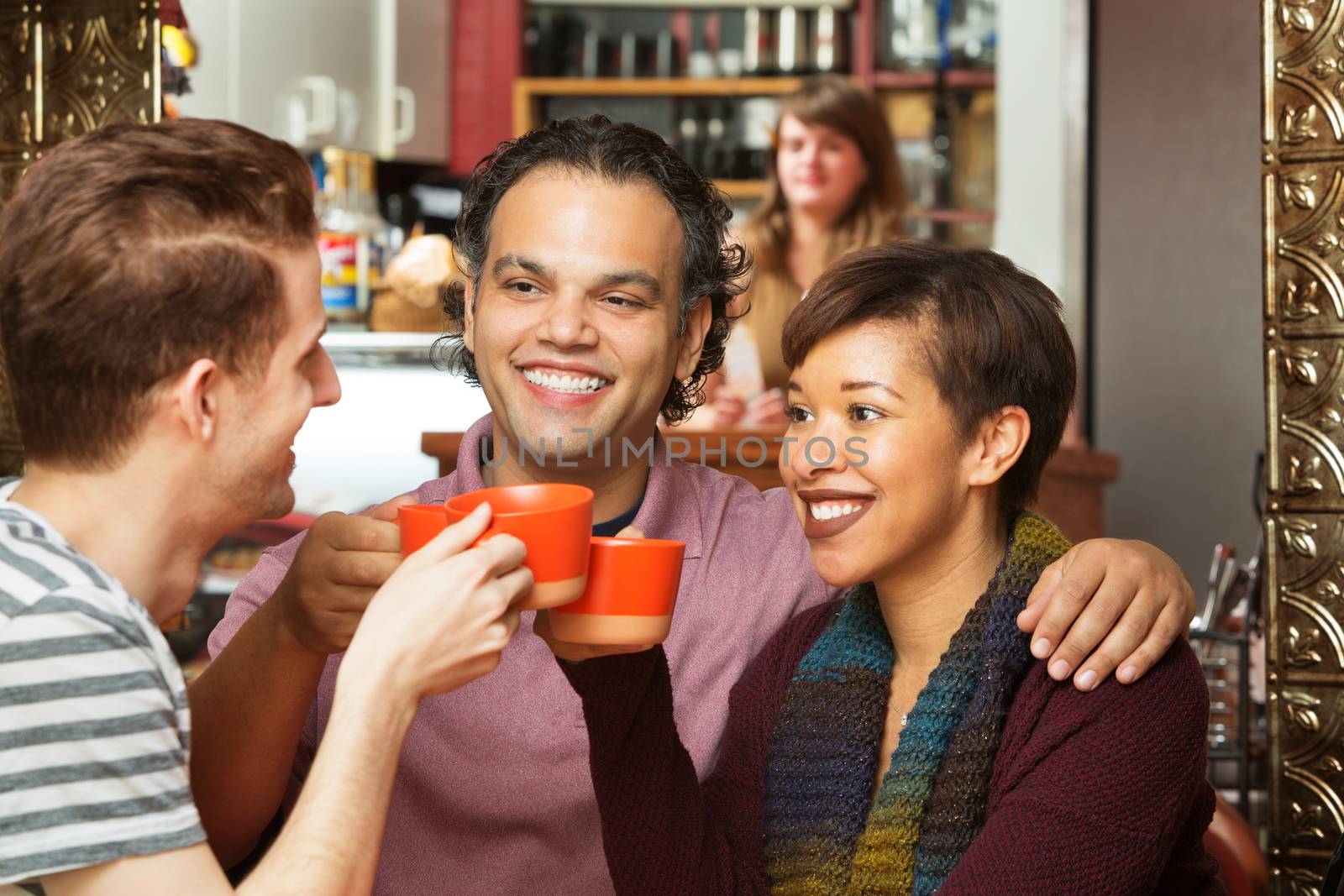 Diverse group of adults toasting with coffee cups