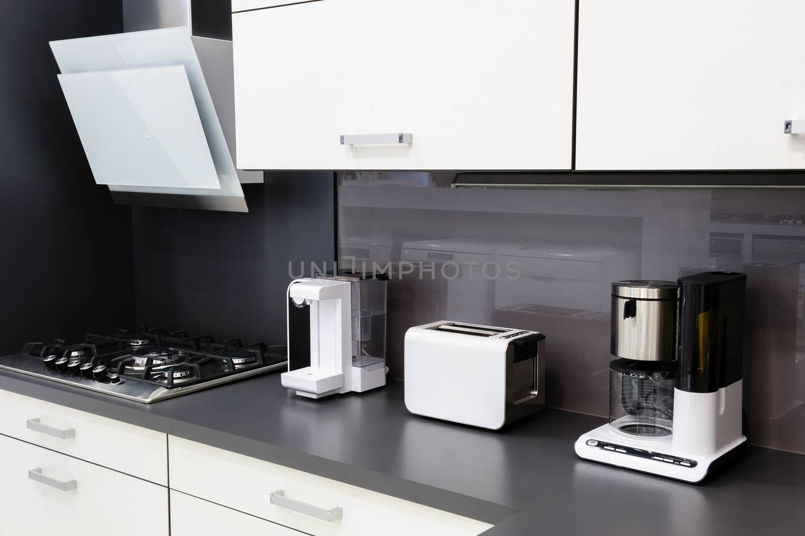 Modern luxury black and white kitchen in high tech style