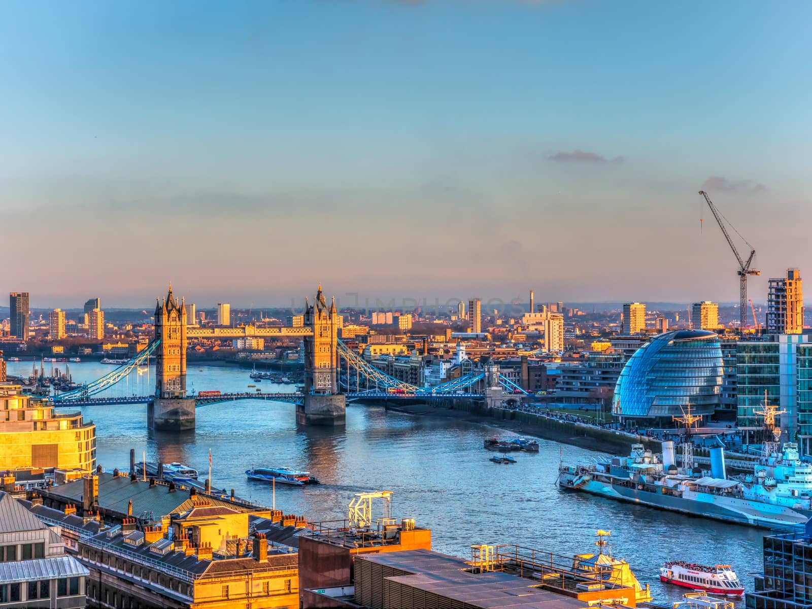 Overview of River Thames in Sunset in London. Tower Bridge and the City Hall in the Background
