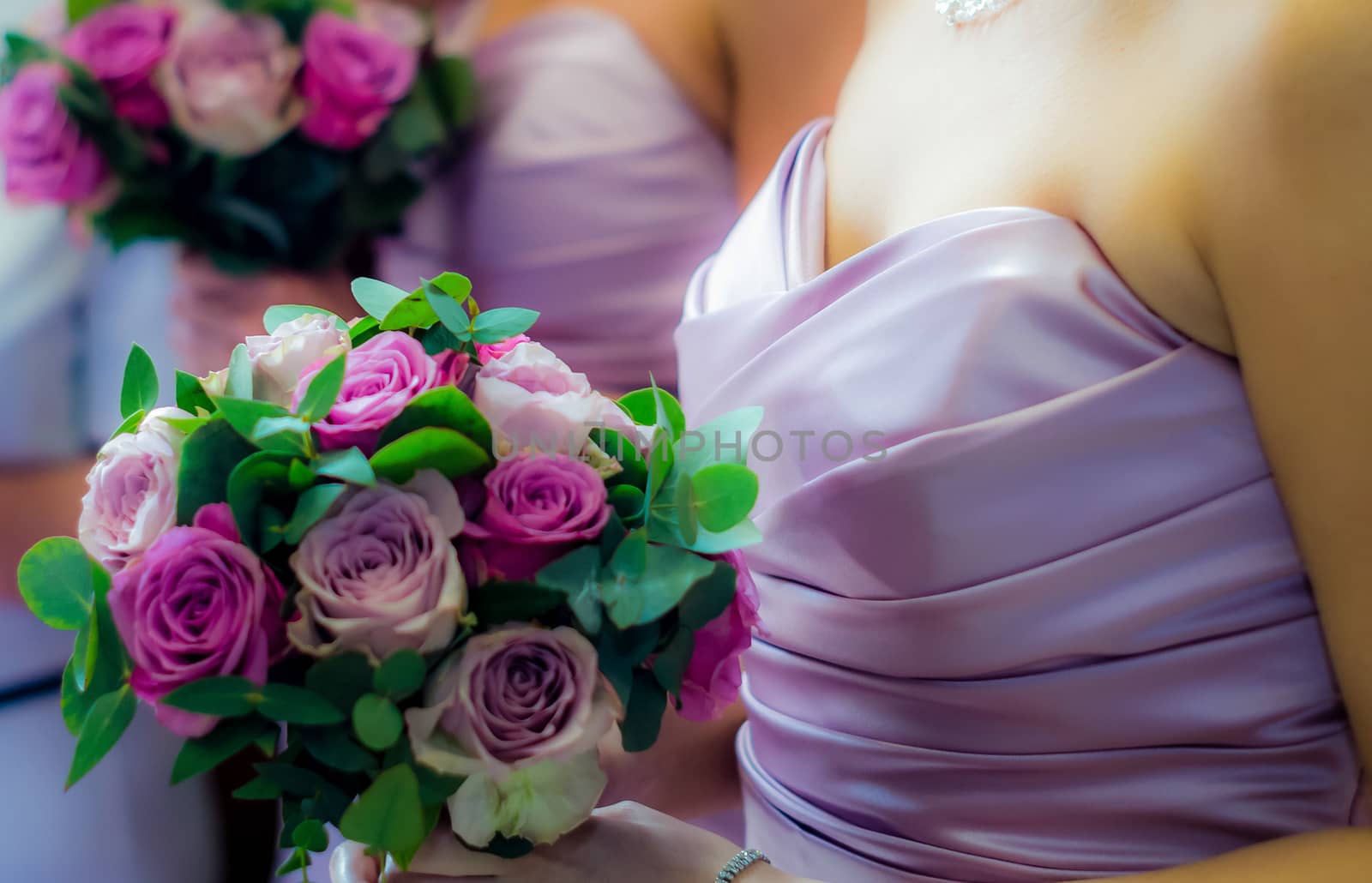 Bridesmaids Holding Colorful Wedding Bouquets by PhotoLondonUK