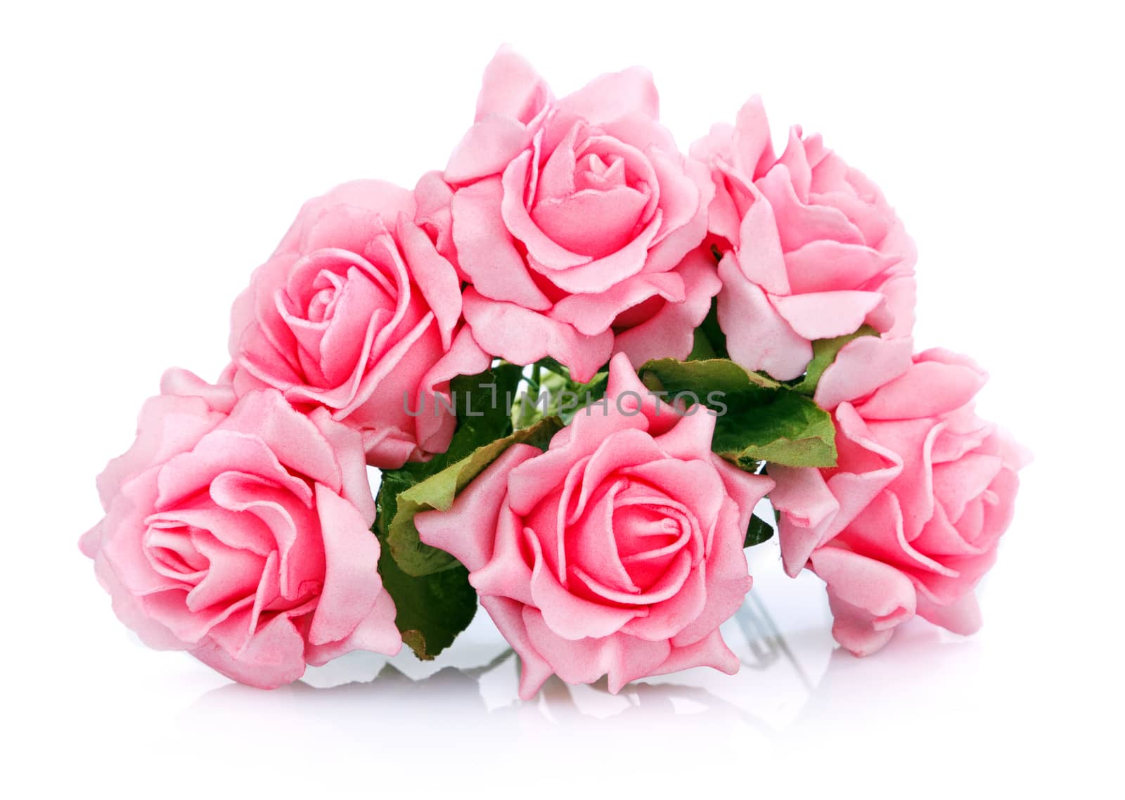 artificial bouquet of pink roses on a white background