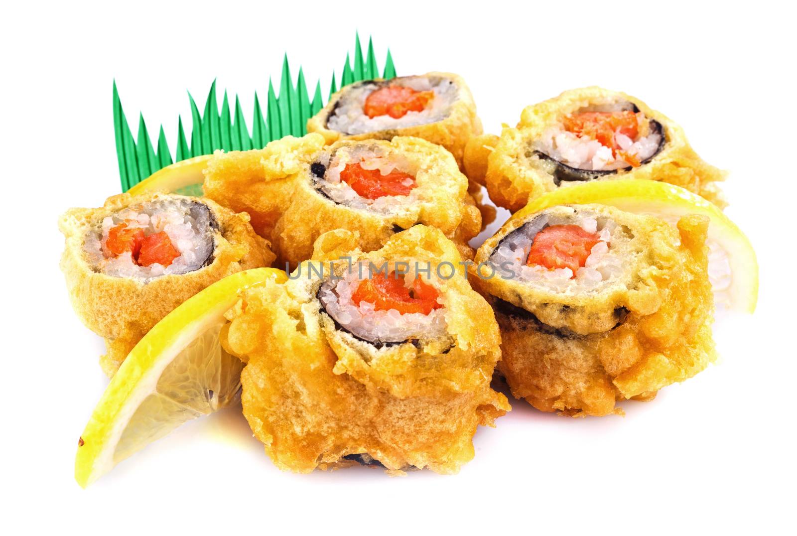 sushi roll fried in tempura batter with lemon isolated