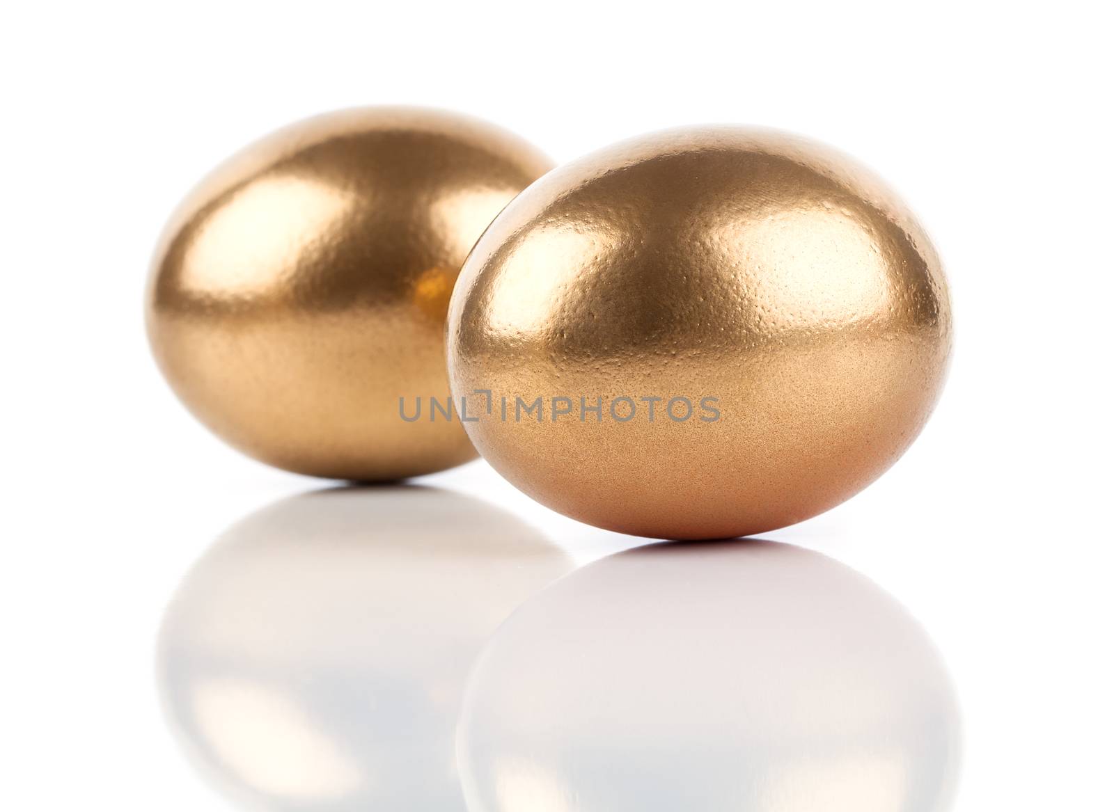 golden eggs isolated on white background