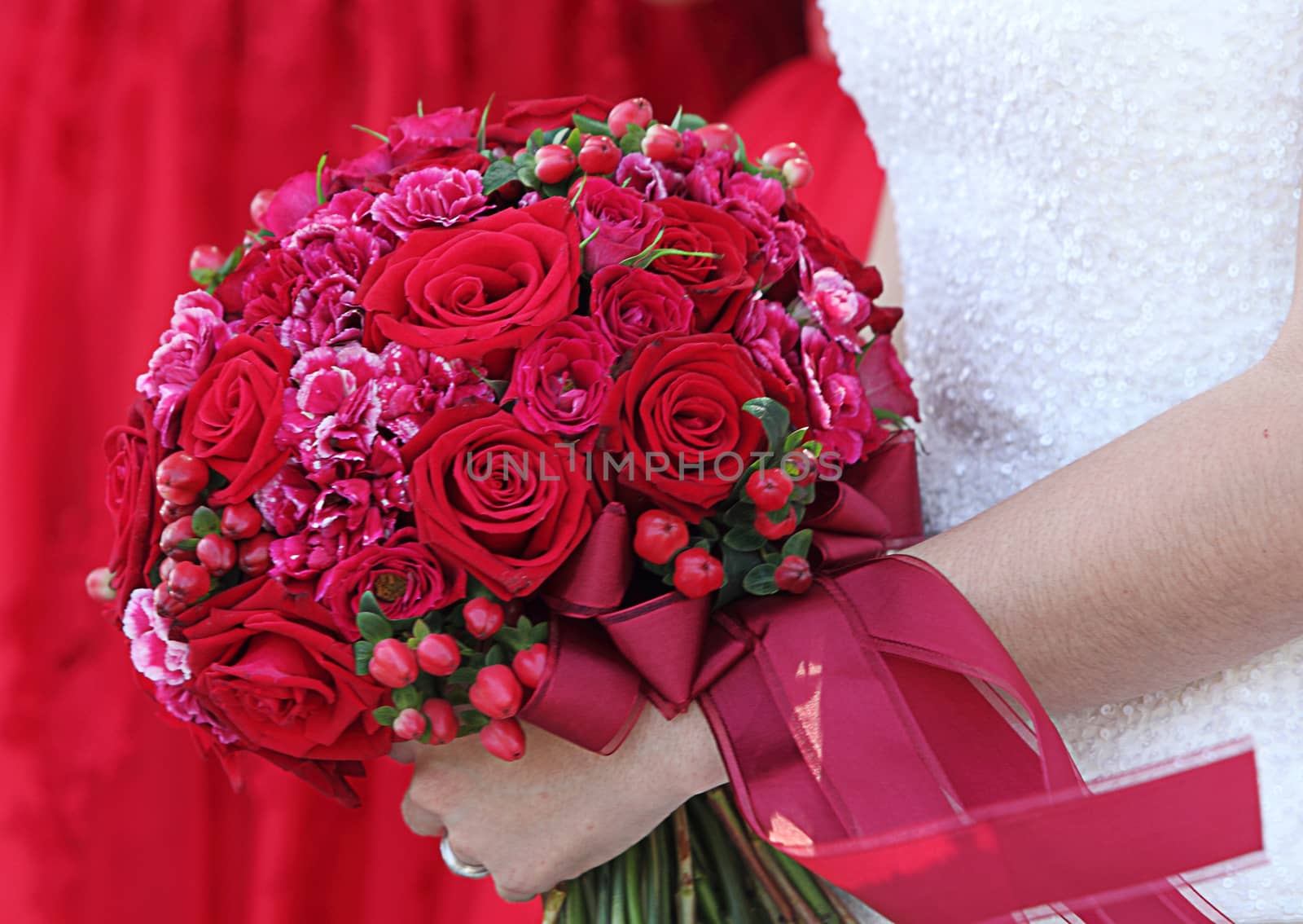 Wedding bouquet in hands of the bride