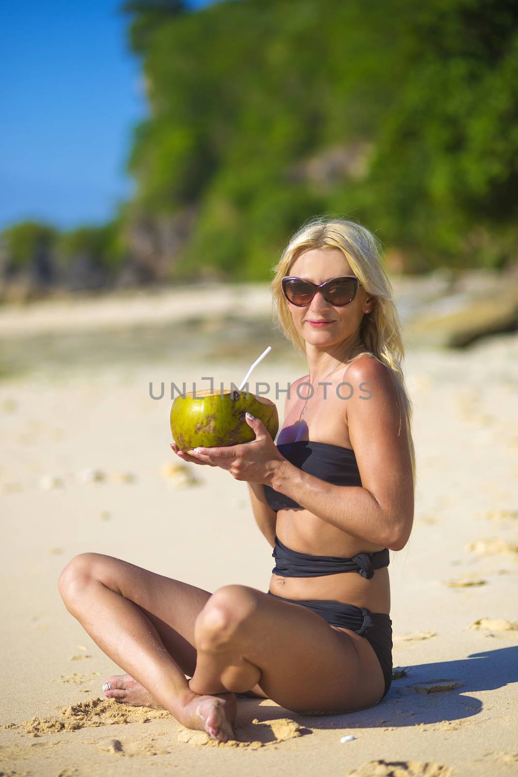 Young Woman in Bikini in Tropical Island
released