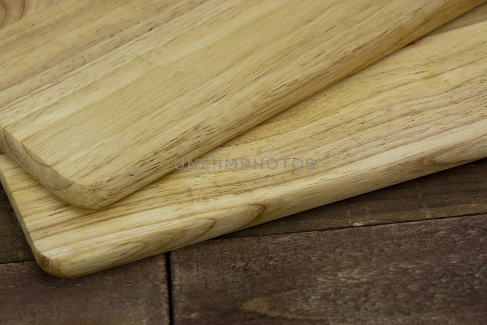 Wooden chopping board on an old table