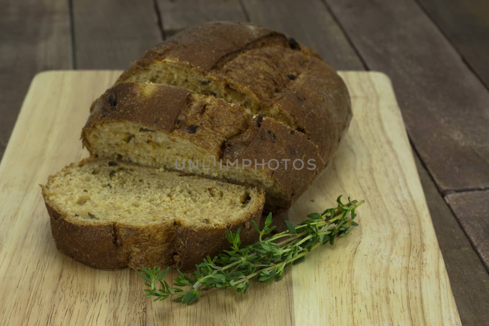 Loaf of wholemeal brown bread cut ready to serve