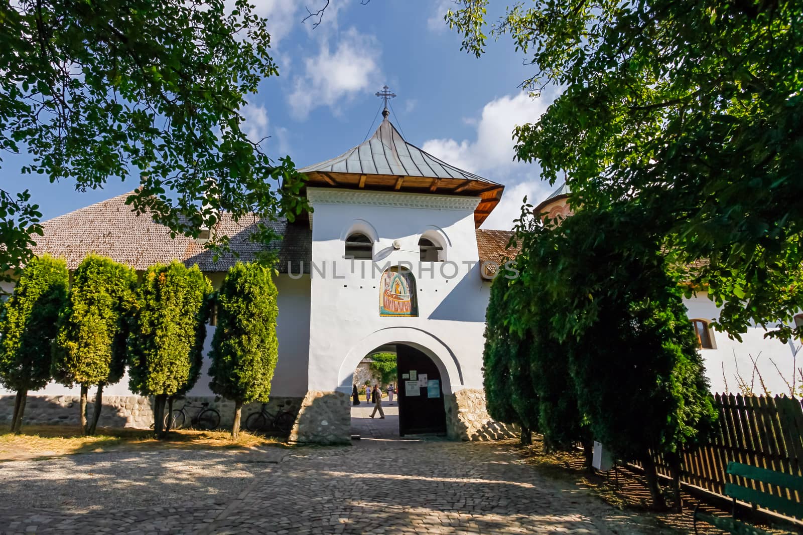 Polovragi, Romania - September 2, 2012: Old orthodox monastery from Polovragi with visiting tourists inside, Romania