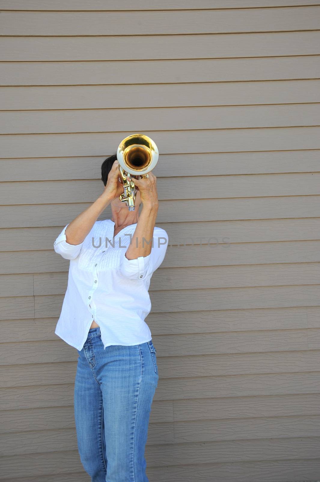 Female trumpet player. by oscarcwilliams