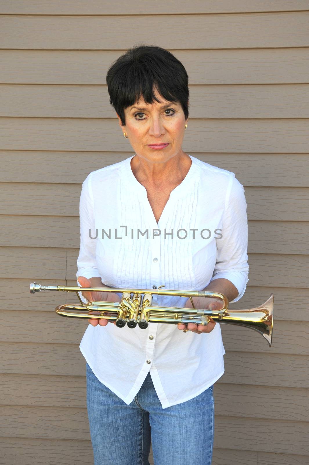 Female trumpet player. by oscarcwilliams