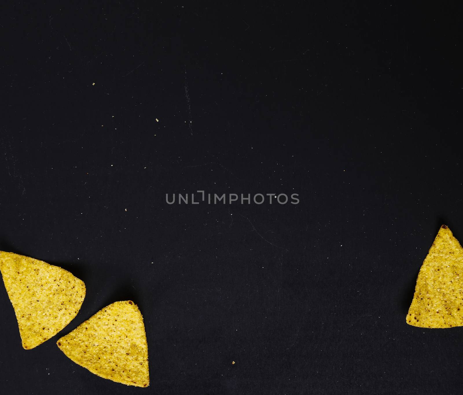 Potato chips on a black background