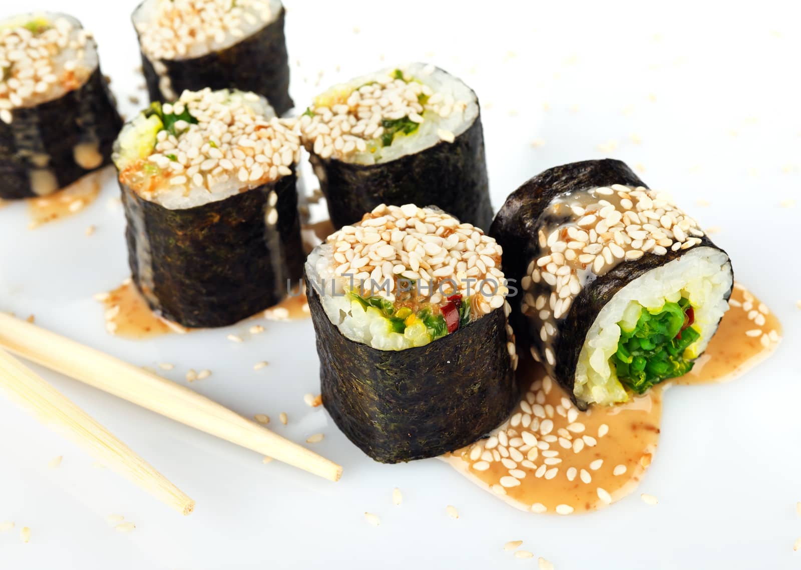 Traditional japanese sush with two Chopsticks isolated on white background