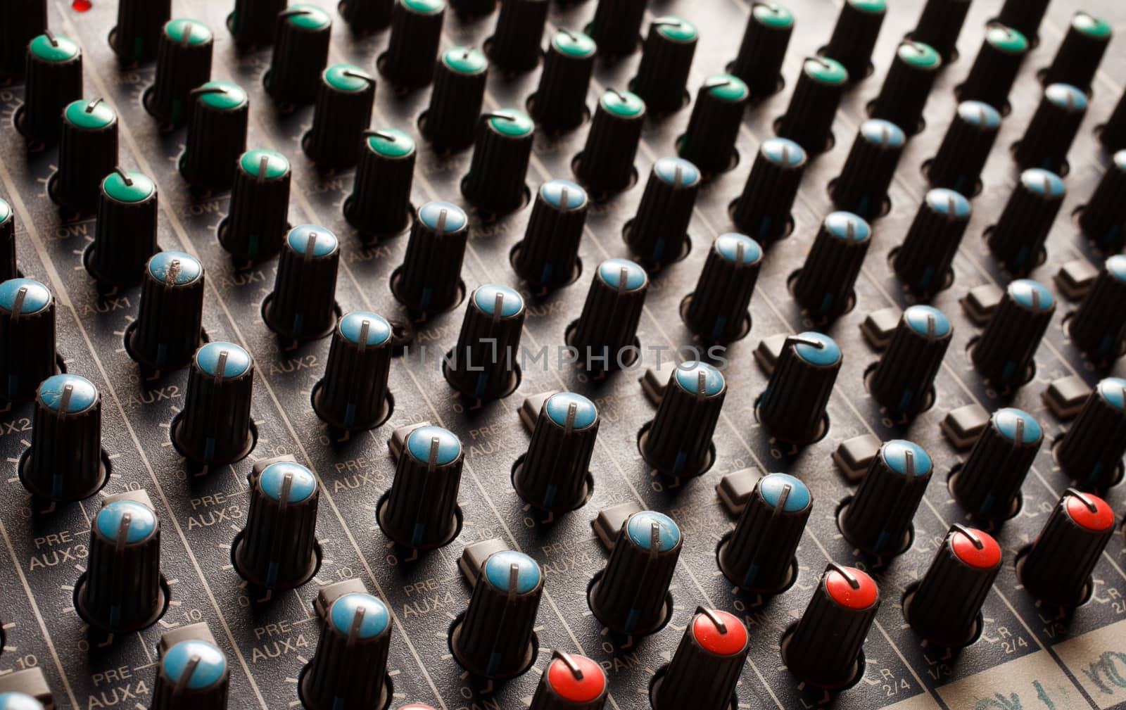 Knobs of a studio soundboard closeup