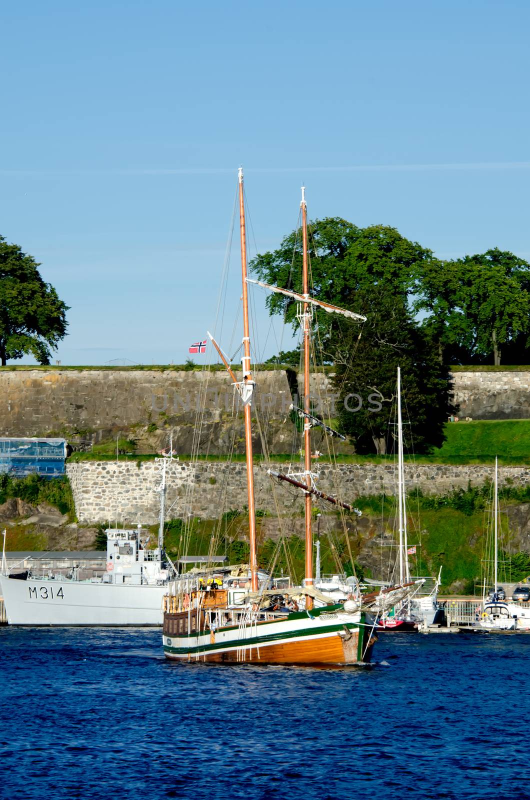 Boat with Akershus Fortress on background, Oslo, Norway