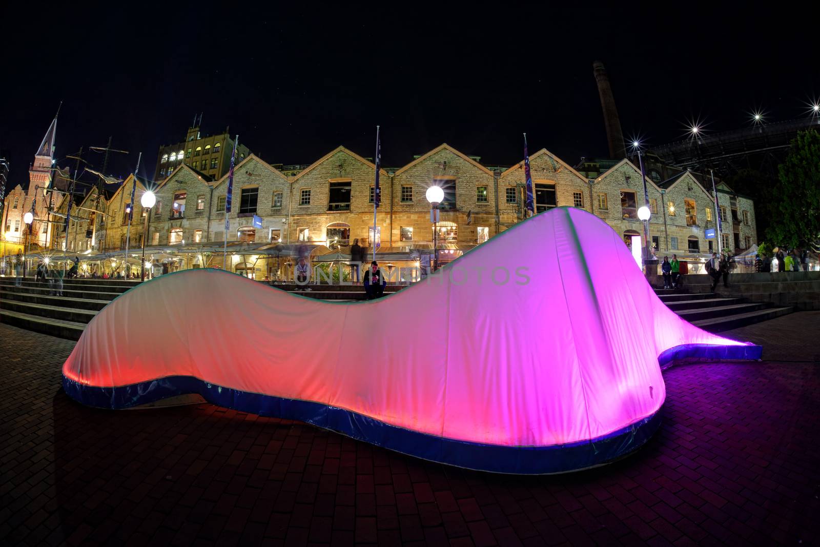 SYDNEY, AUSTRALIA - JUNE 8, 2015; Lux Forma presents the organic form of an elongated wave, illuminated from within by a varying sequence of colour.