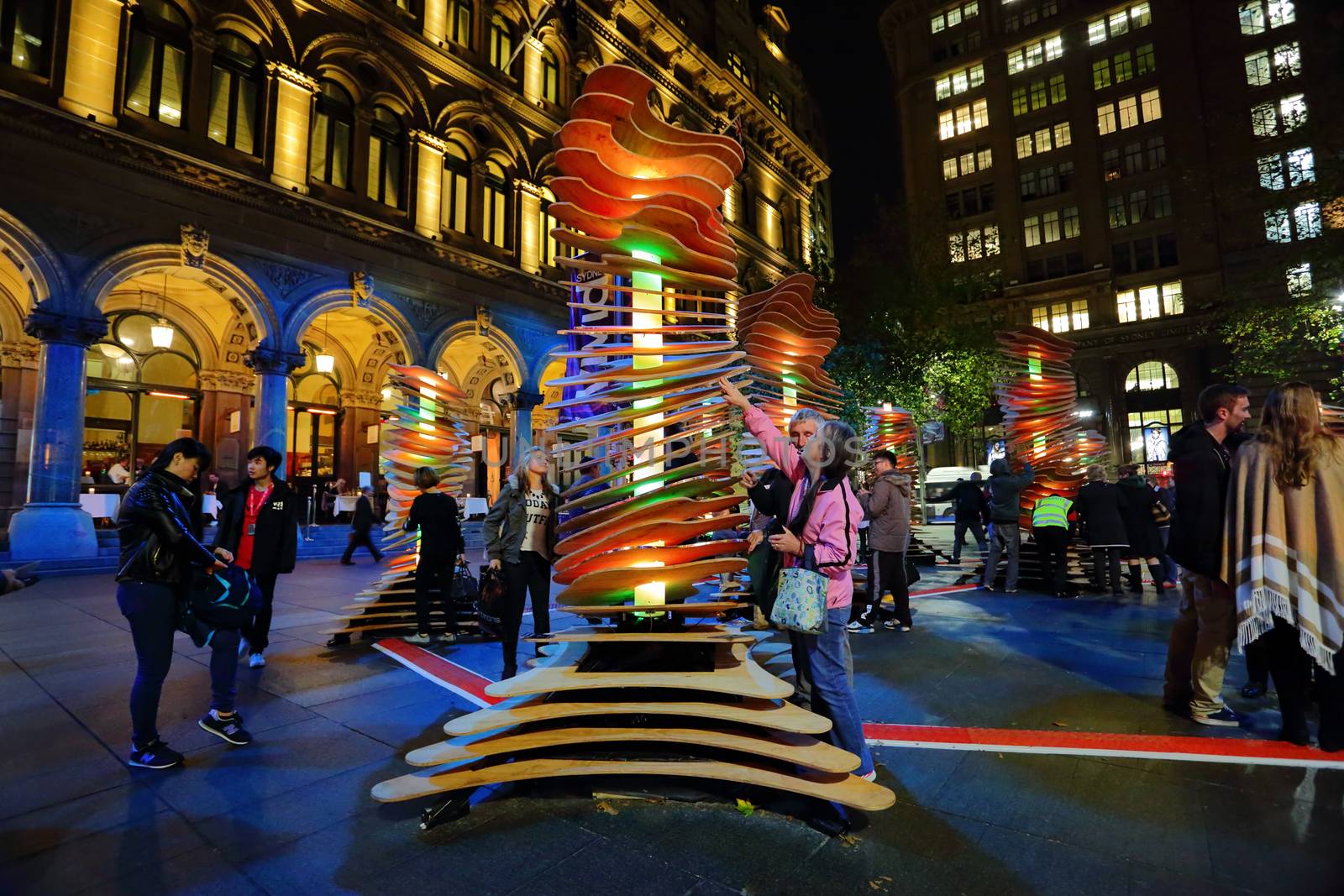SYDNEY, AUSTRALIA - MAY 26, 2013;  Visitors interact with Robotanic in Martin Place, part of Vivid Sydney. When touched light and soothing chimes of nature sound.  Artist:  Thomas Martin / Sebastian Barkoczy