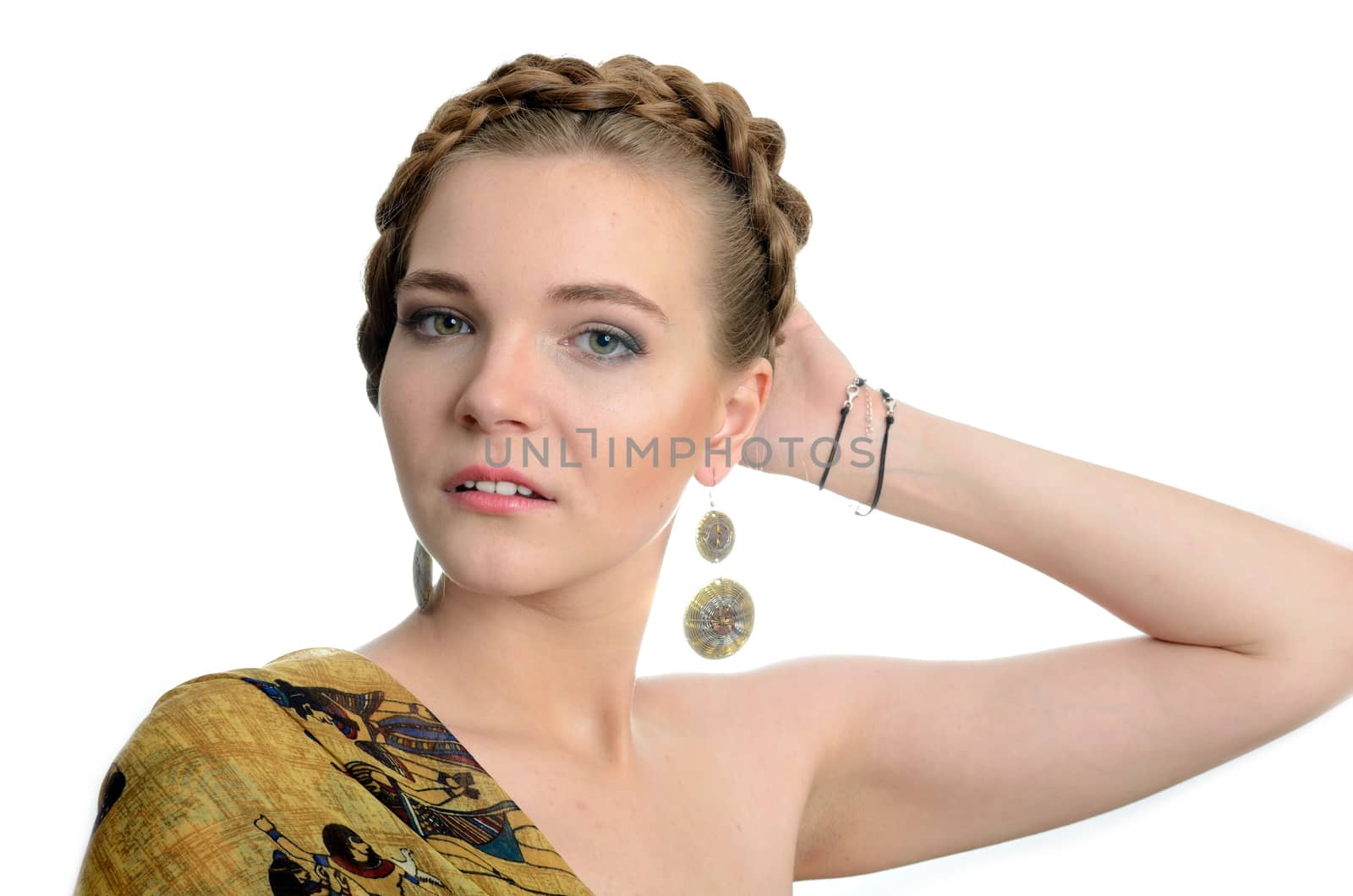 Female model with earrings. Young girl with blond hairs, pretty with kind face expression.