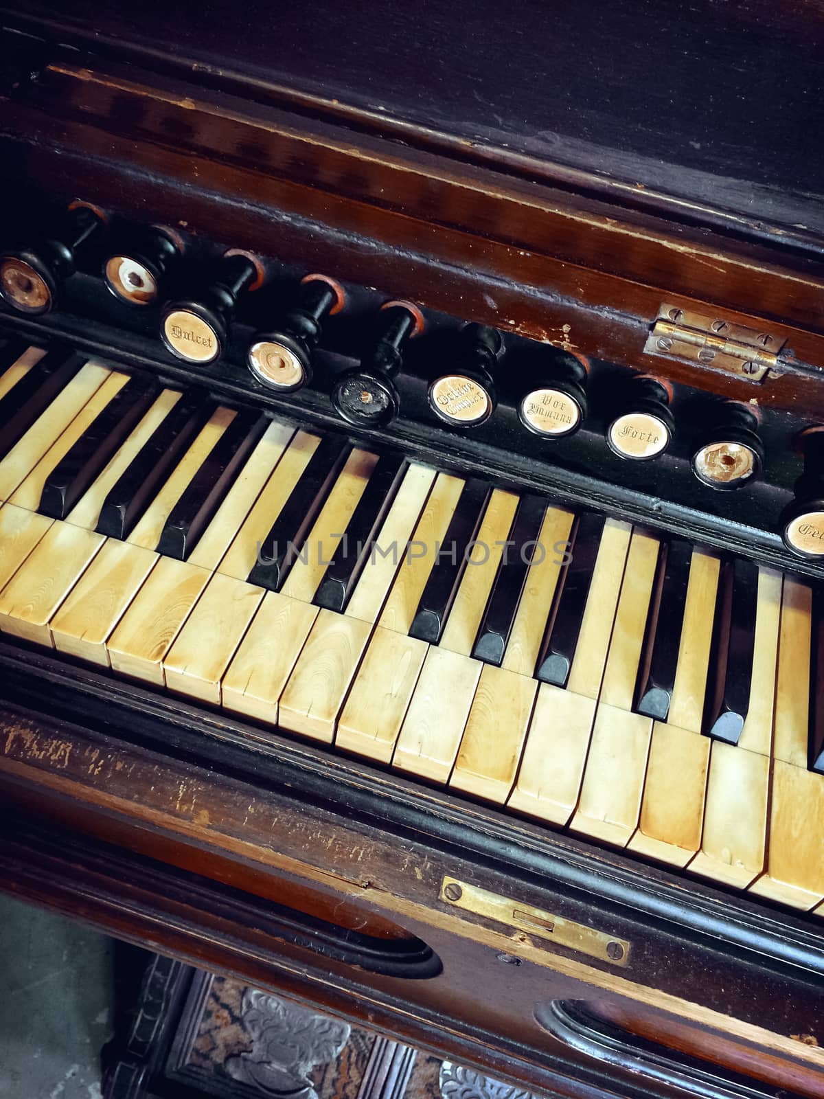 Close-up of antique reed organ (harmonium).