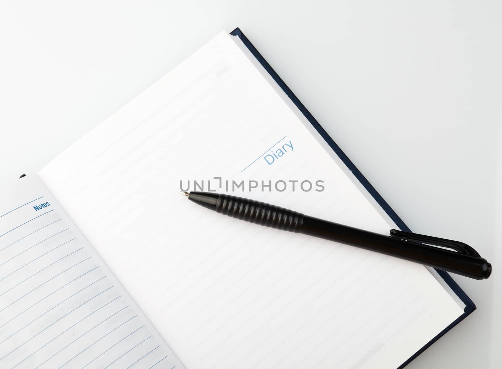 Open notebook with pen  by serkucher