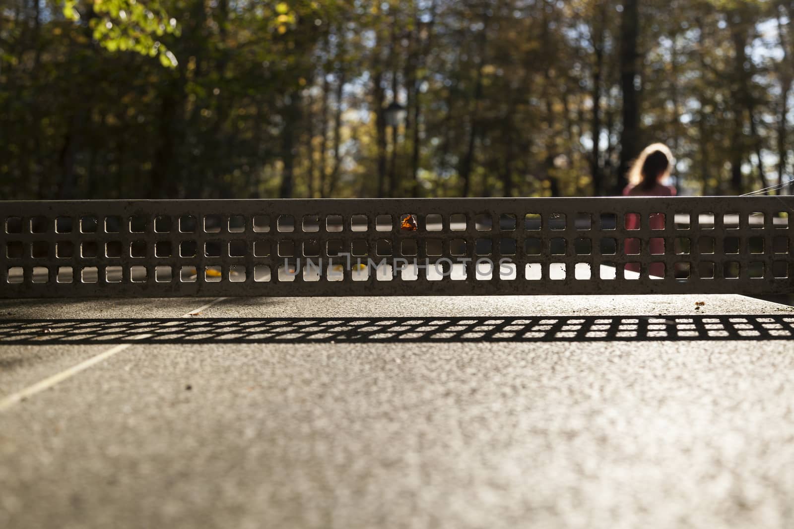 A girl behind a net to symbolize loneliness