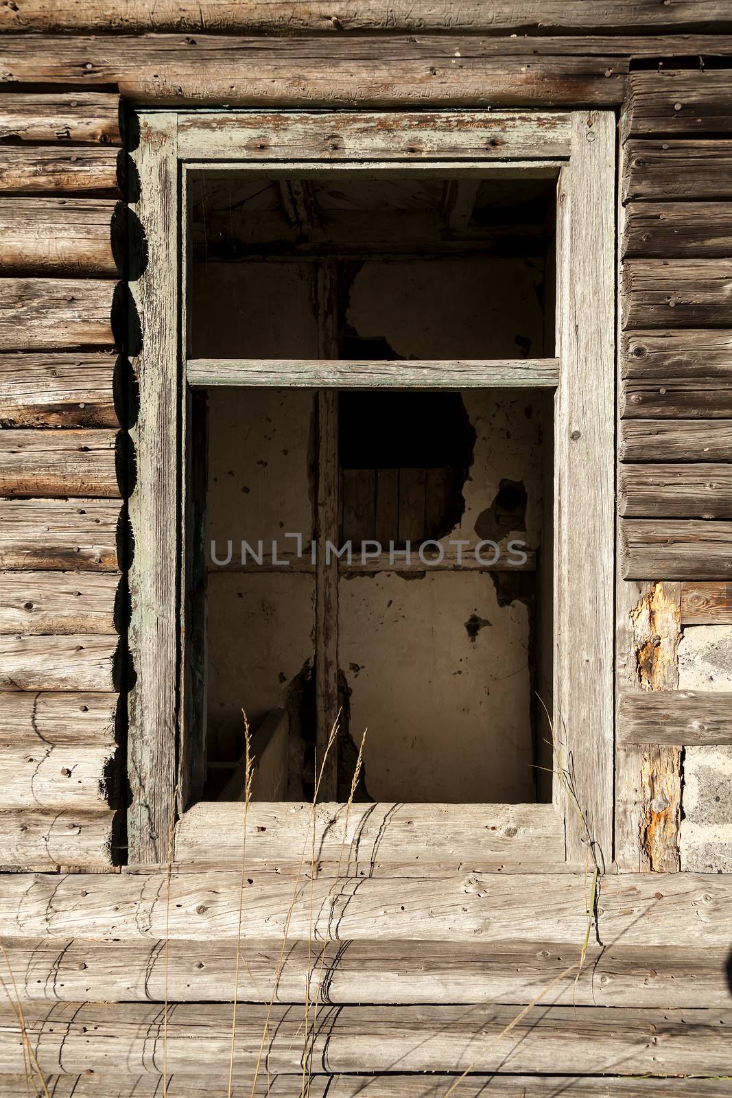 An old broken window on an old building