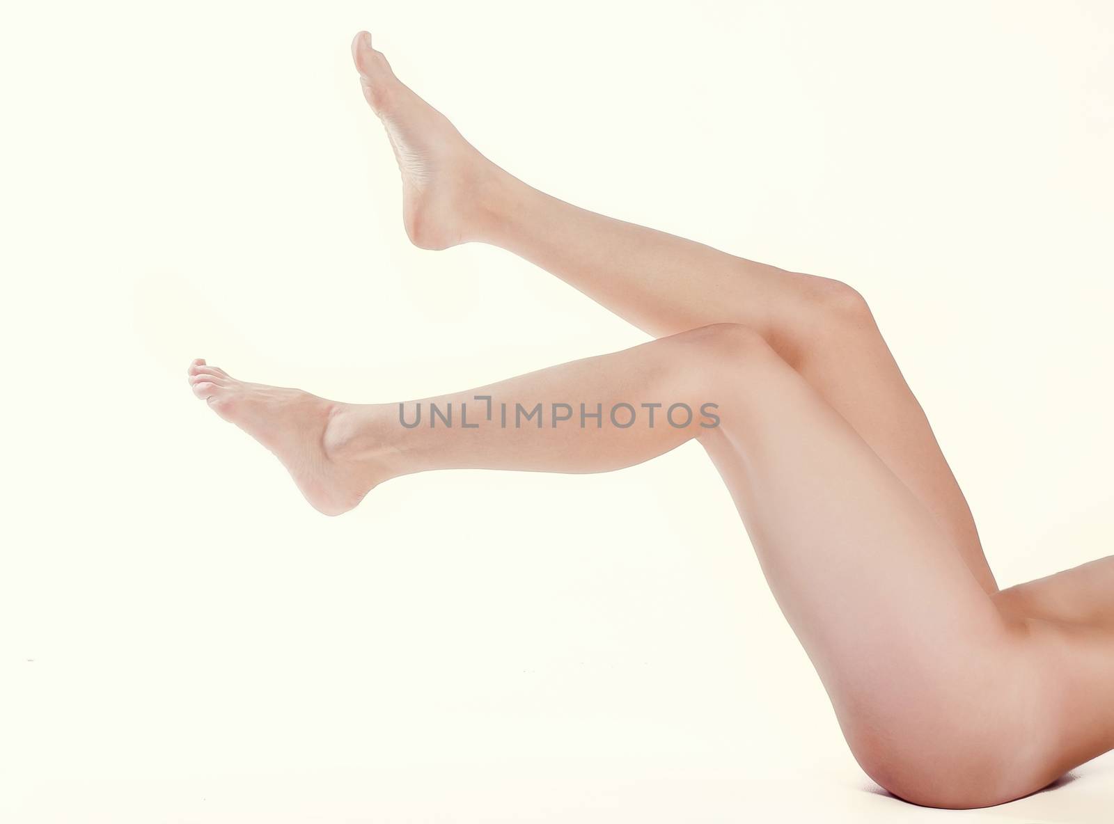 pretty female legs on white background