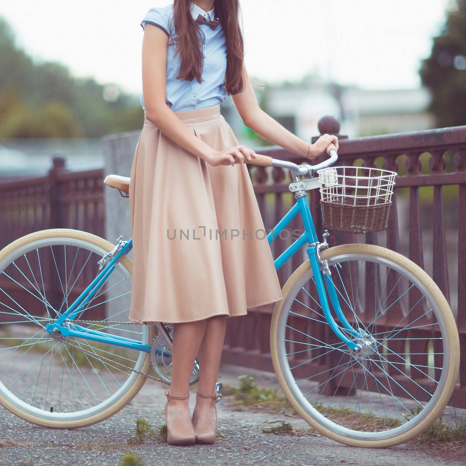 Young beautiful, elegantly dressed woman with bicycle. Beauty, f by vlad_star