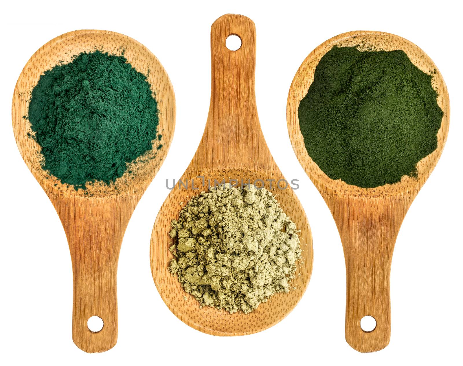 spirulina, kelp and chlorella supplement powders - top view of isolated wooden spoon