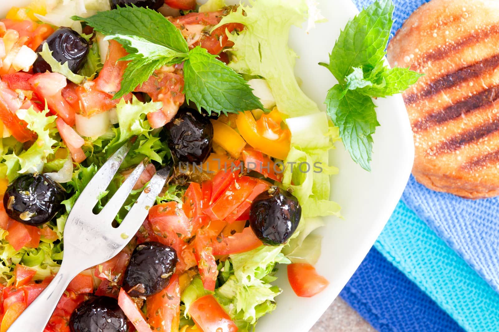 Fresh Mediterranean salad with toasted bread by coskun