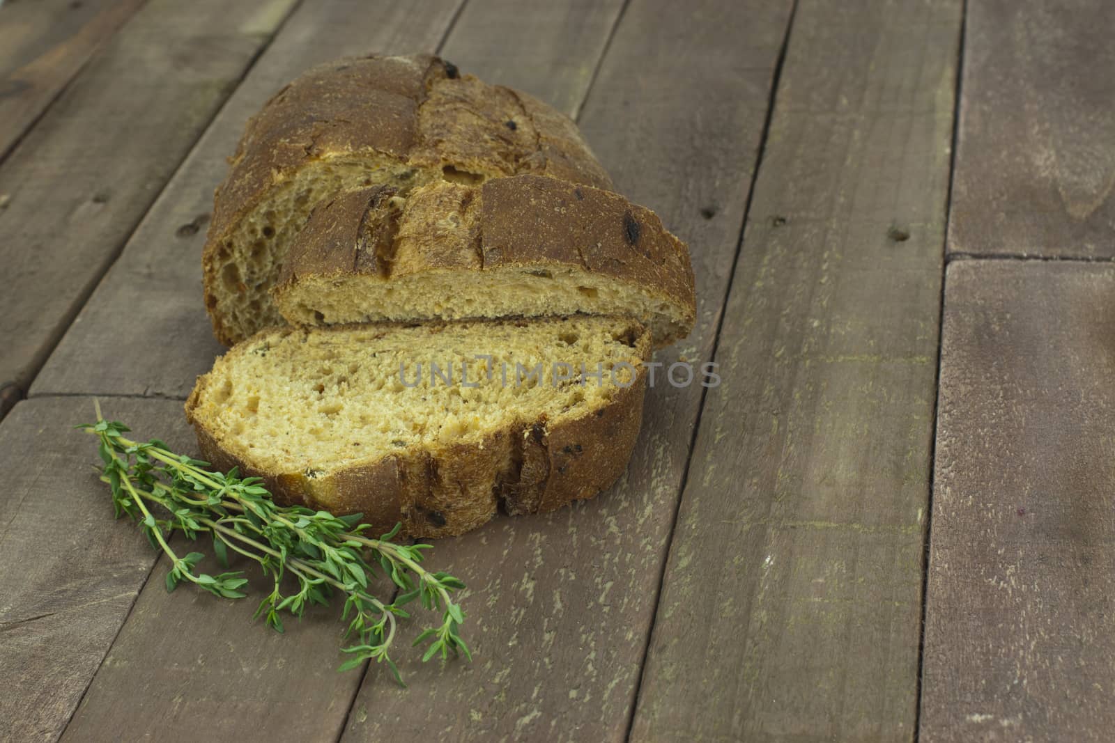 Loaf of wholemeal brown bread cut ready to serve