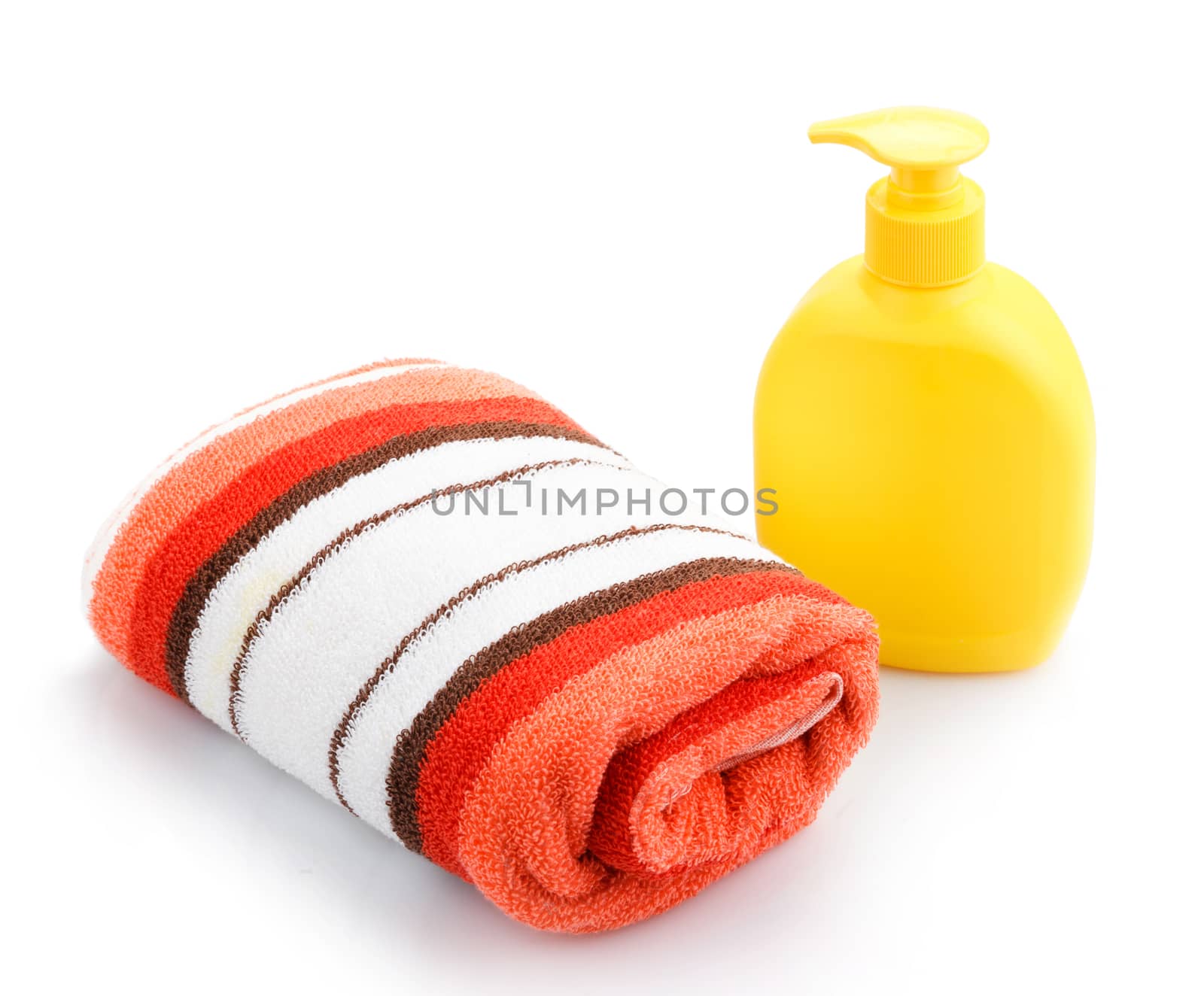 Towels and Soap Dispenser isolated on white