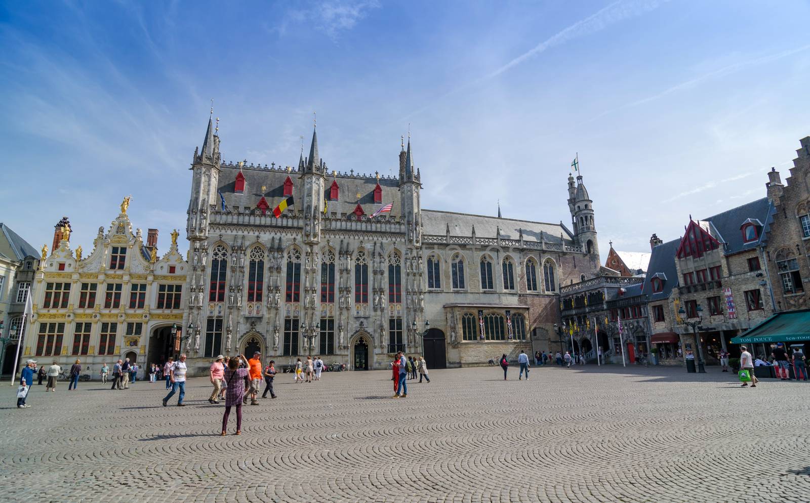 Bruges, Belgium - May 11, 2015: Tourist on Burg square in Bruges, Belgium by siraanamwong