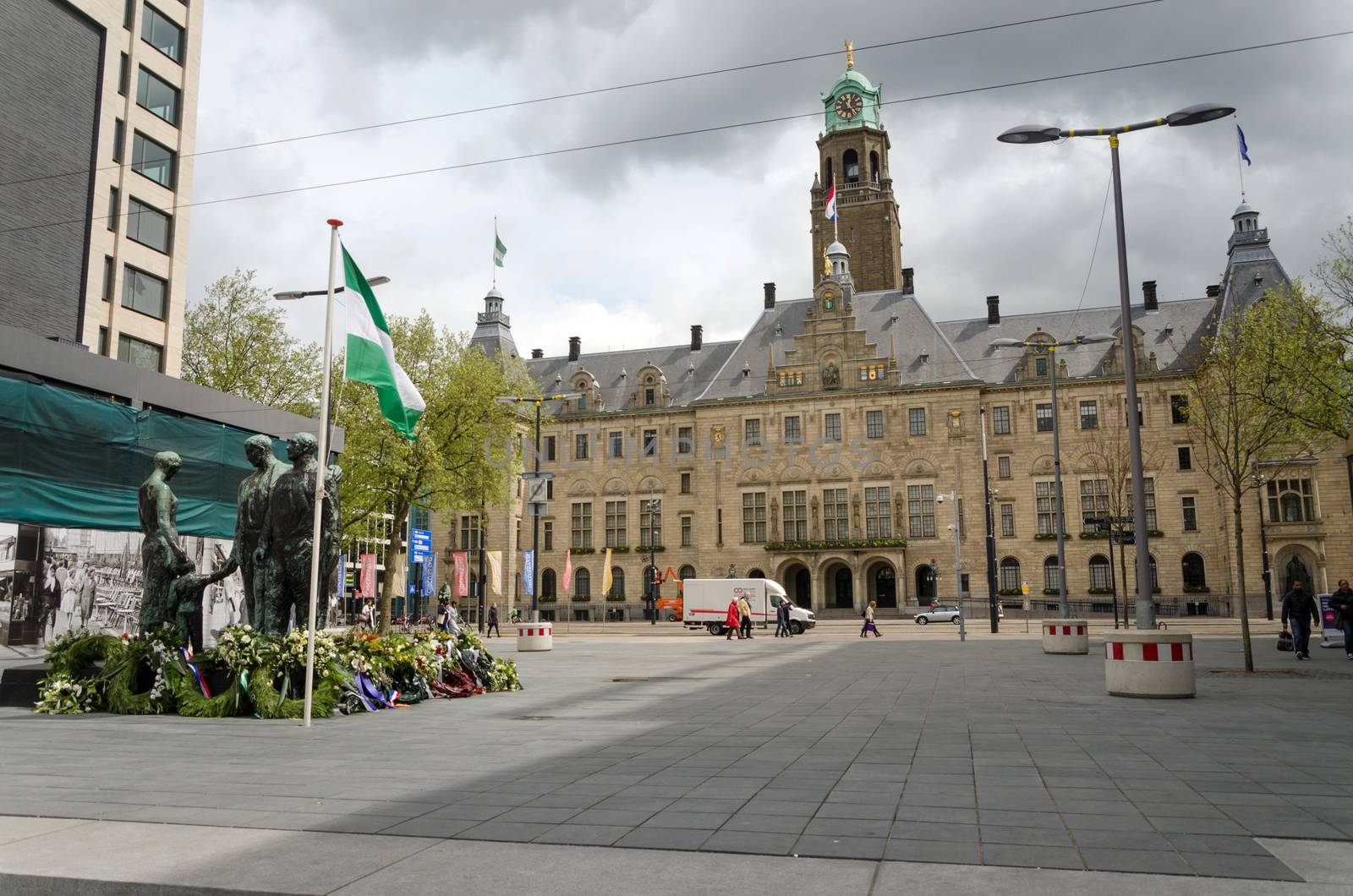 Rotterdam, Netherlands - May 9, 2015: People visit Town hall of Rotterdam view from Stadhuisplein. The foundation stone was laid by Queen Wilhelmina on July 15, 1915.