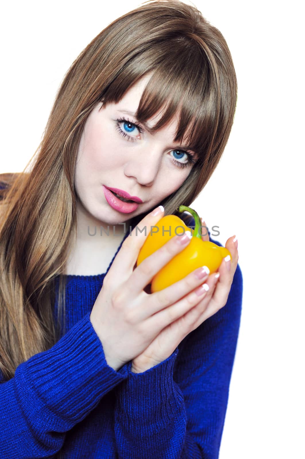cute longhaired  girl with orange fresh pepper 