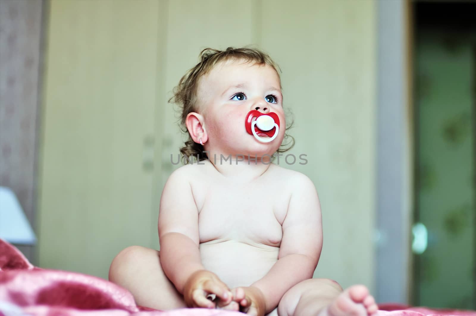 baby with soother by Reana