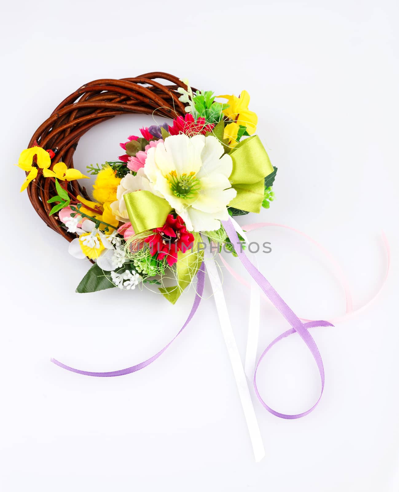 wreath of twigs and flower composition on a white background