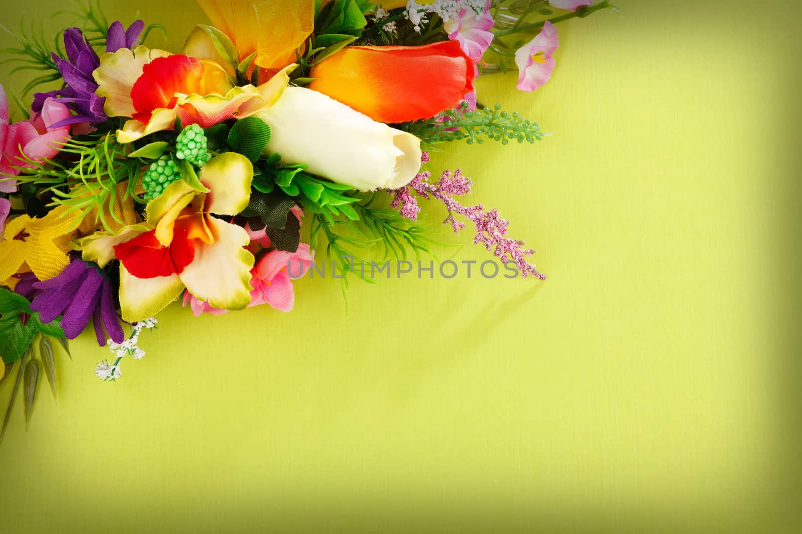 flower arrangement on a green background with blank  for advertisement