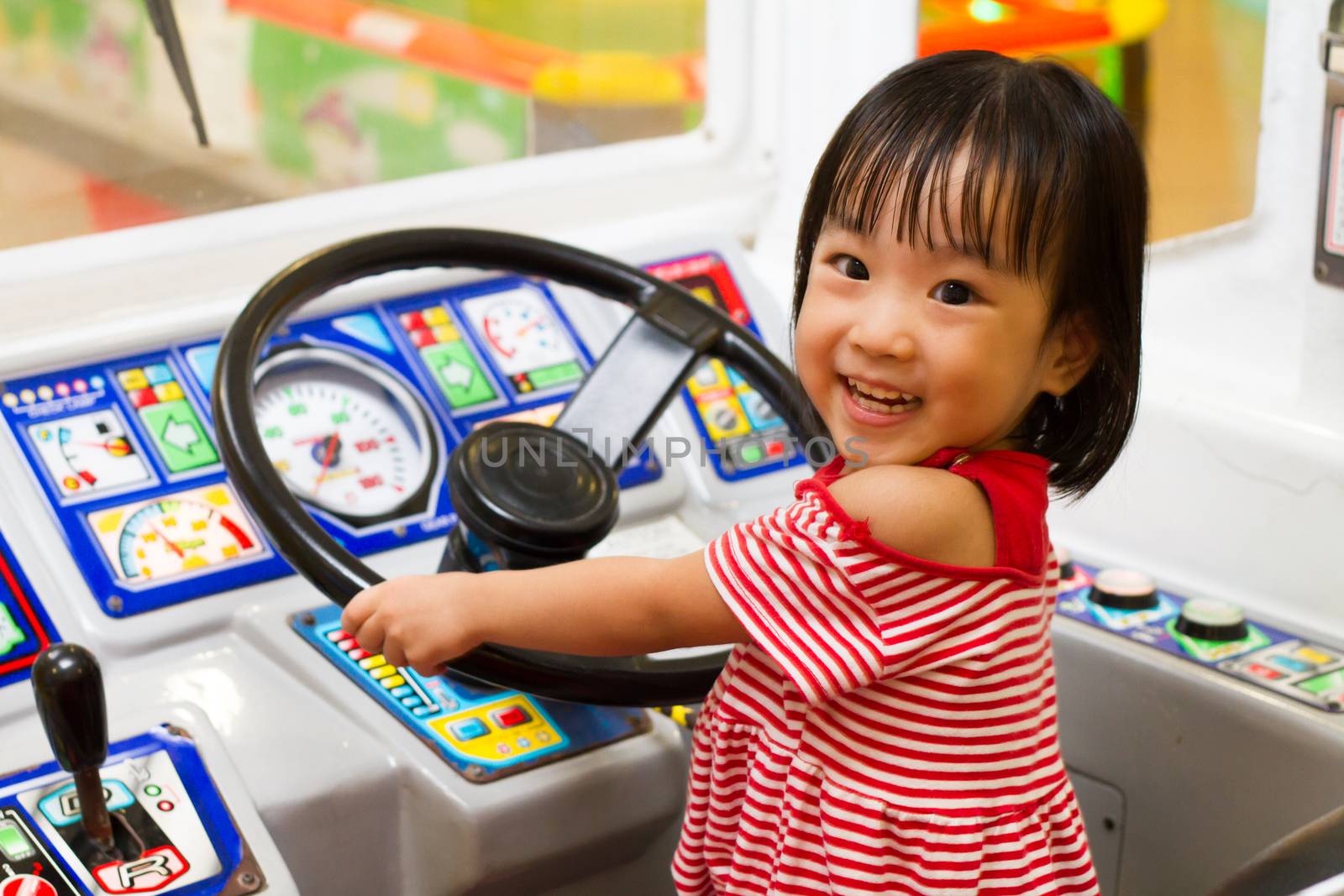 Little Asain Chinese Bus Driver at indoor playground