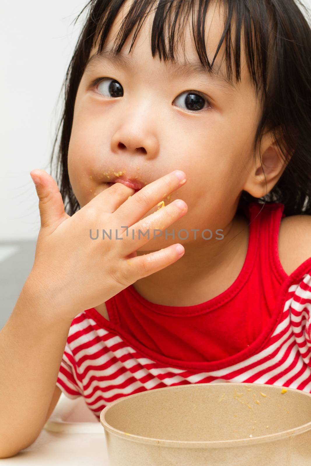 Asian Chinese little girl eating durian fruit
