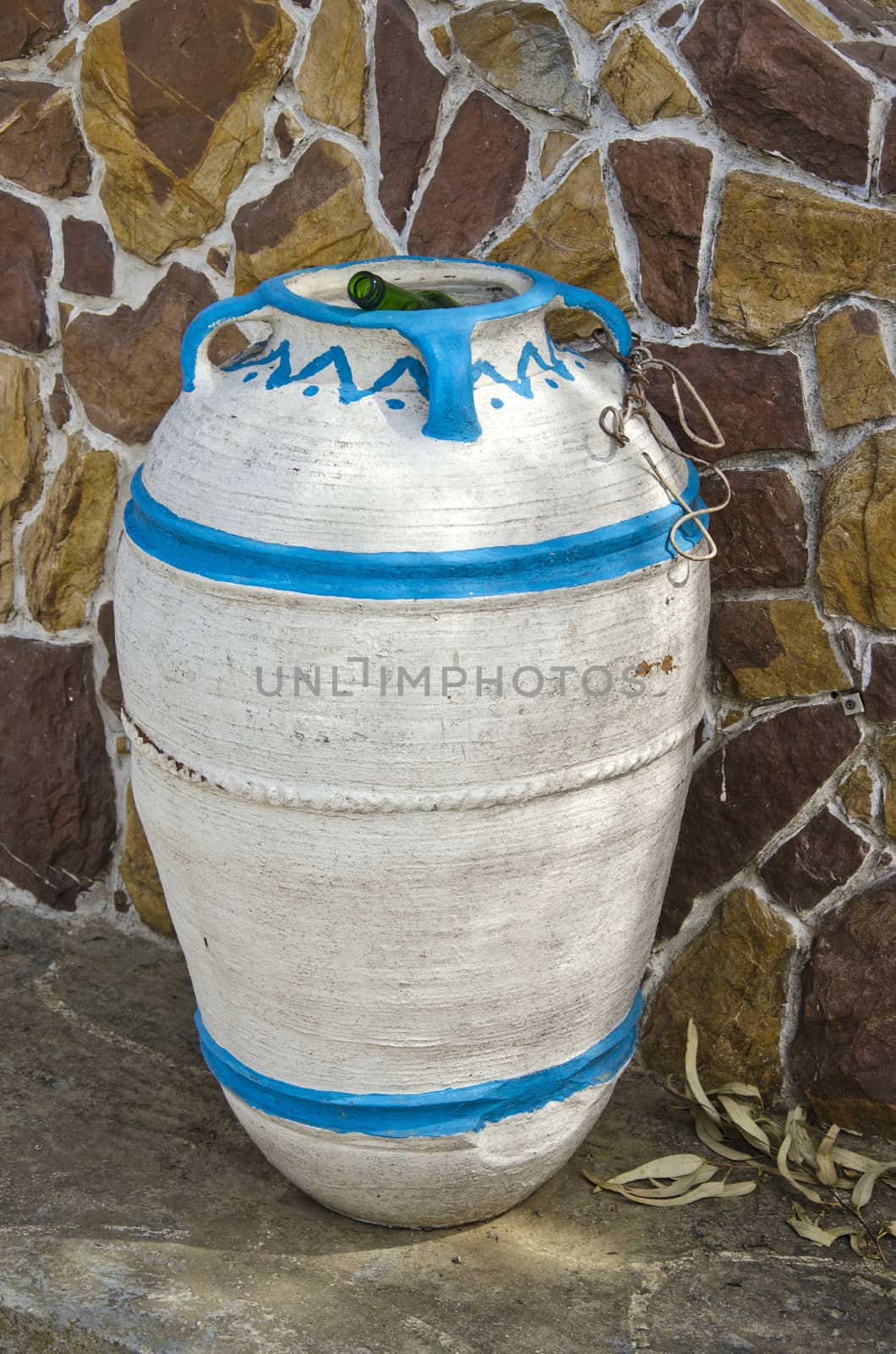 amphora form dust bin in city street, Greece