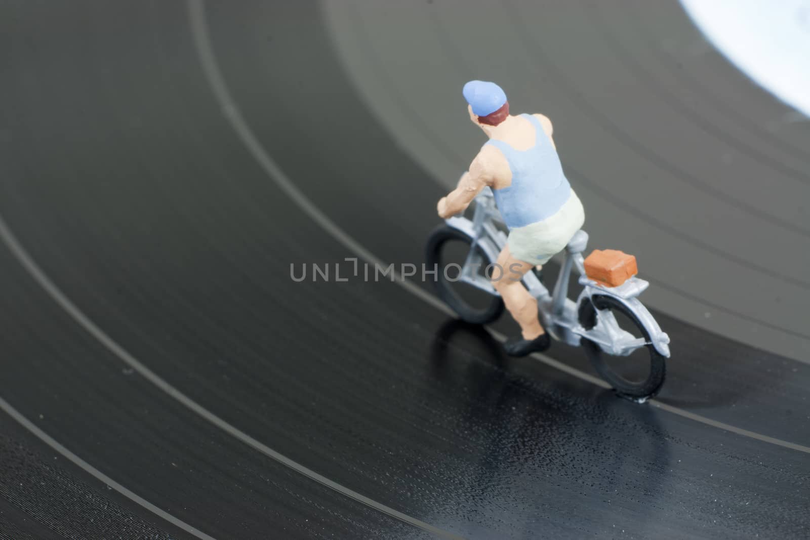 Model people having a cycle race on a record