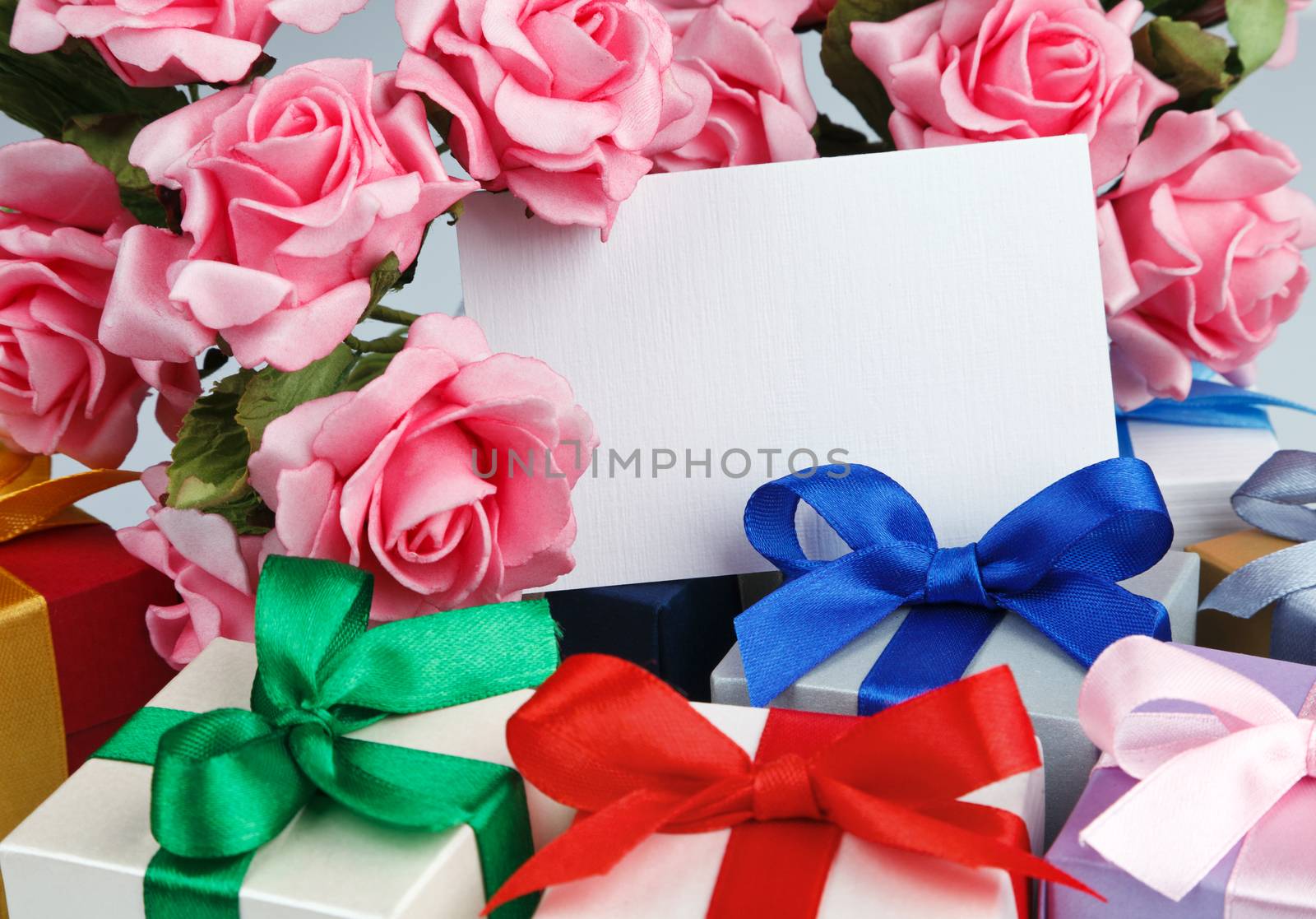 Greeting card with flowers and gift boxes