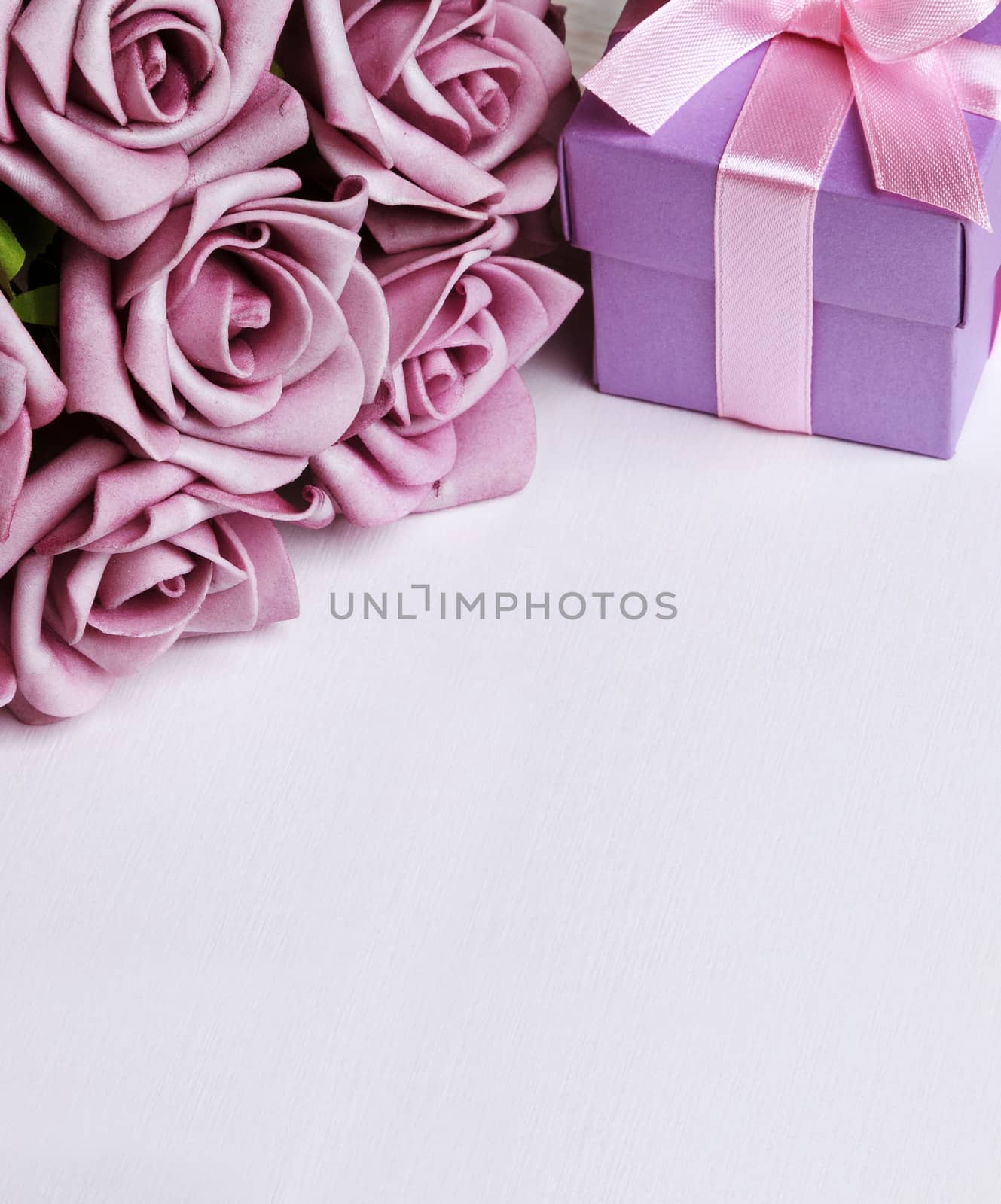 blank card with purple roses and purple gift box