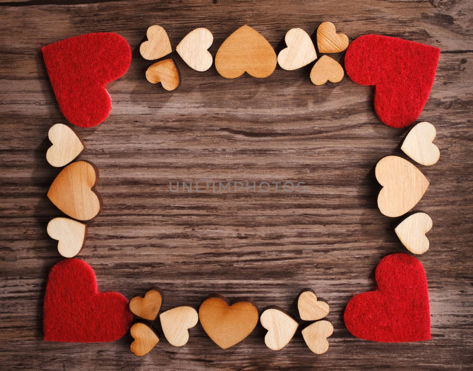 frame with hearts on a wooden board