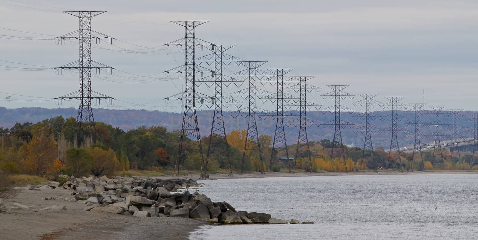 The electrical posts near the water by teo