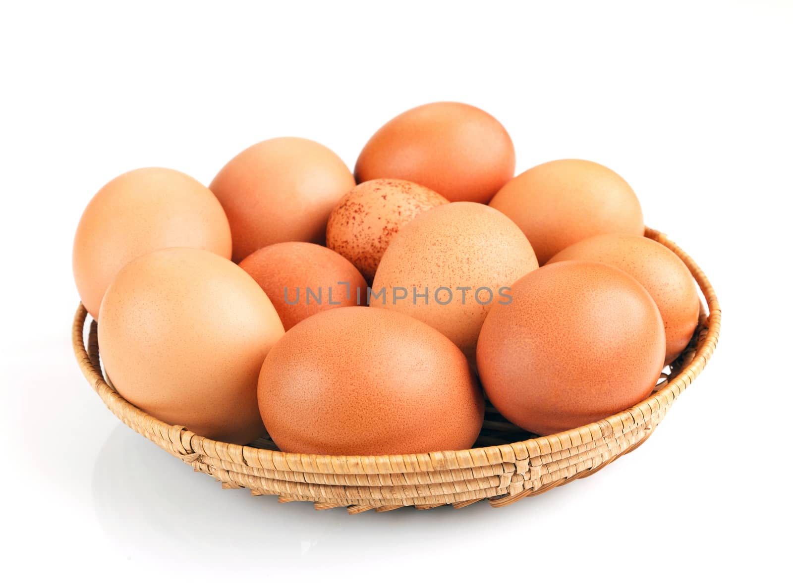 nature chicken eggs in a bowl isolated on white